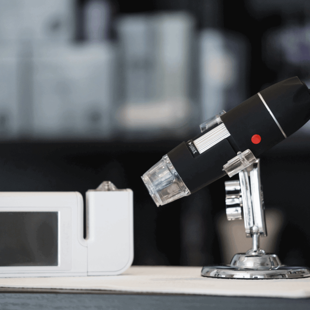 Tricoscope and microscope on a desk